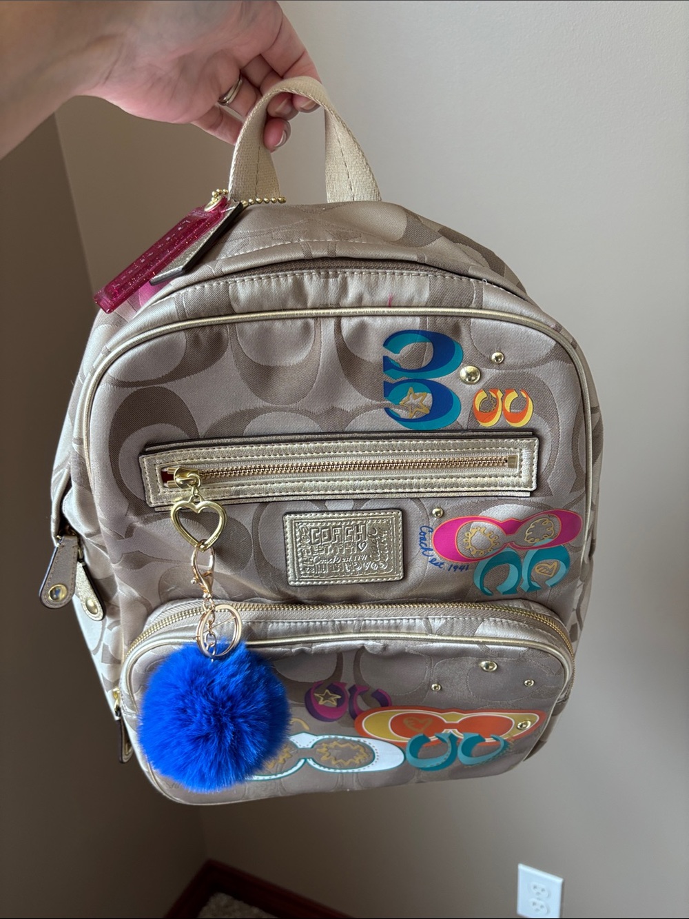 Coach gold poppy backpack